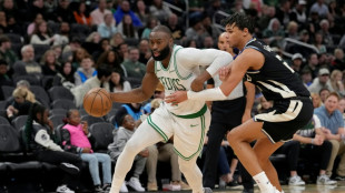 Brown, Tatum fuel Celtics over Bucks, Mavs teen Flagg scores 51