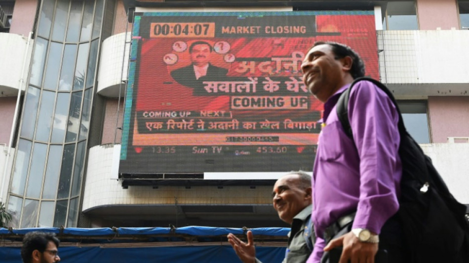 Adani empire tumbles again with stock sale hanging in the balance