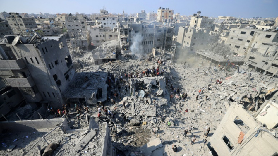 Israel says troops encircle Gaza City 