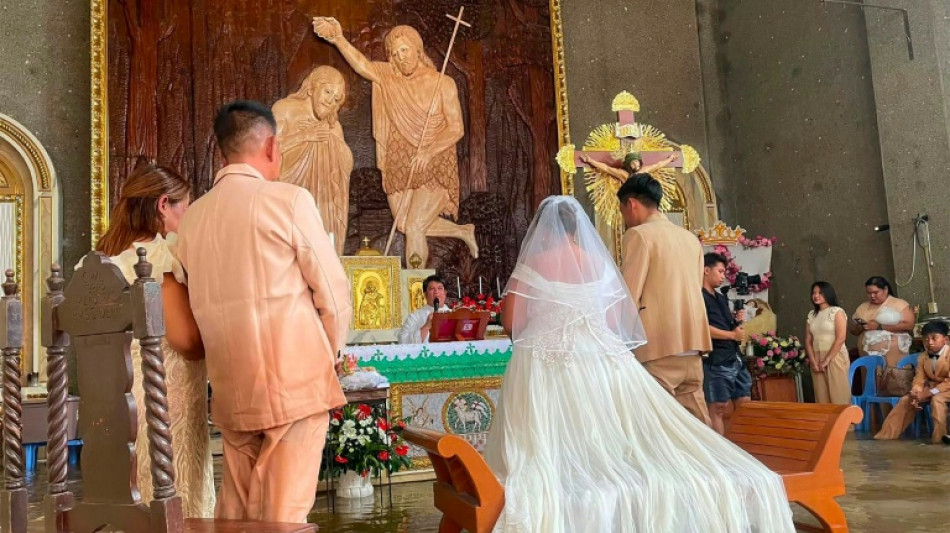Philippine couple married in hip-deep floodwaters
