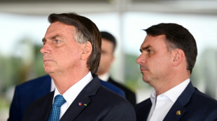 Flavio Bolsonaro visits father under house arrest ahead of Brazil runoff