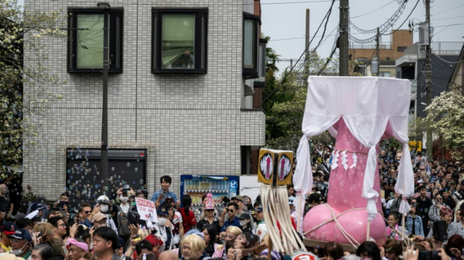 Revellers parade giant penises to dash stigma in Japan's fertility festival