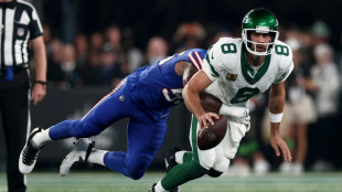 NFL star Rodgers exits early with ankle injury in Jets debut