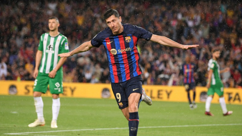 Barca romp past Betis with title in sight